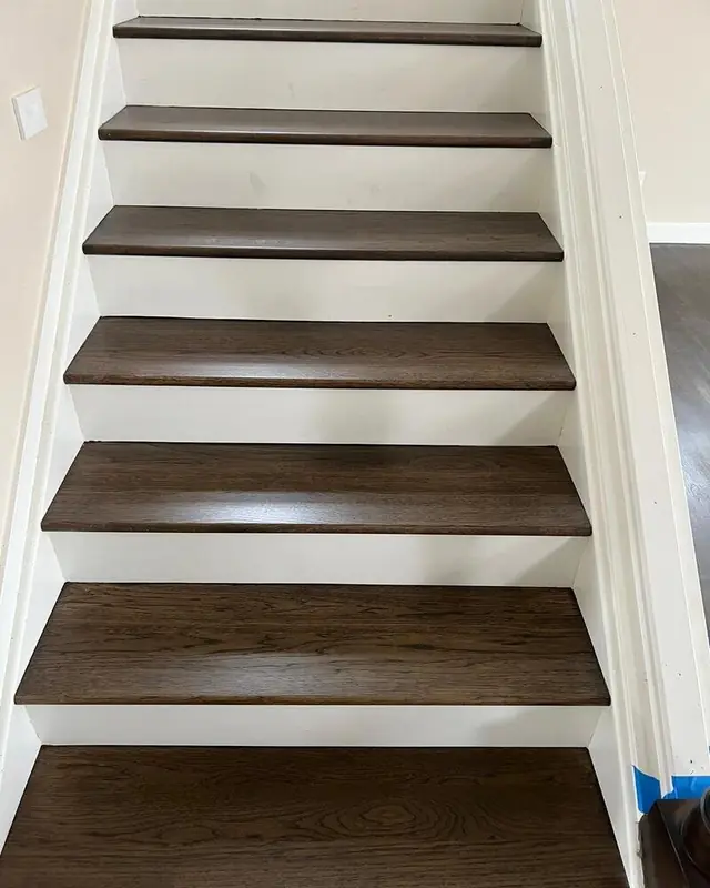 Hardwood stair treads refinished in a dark stain