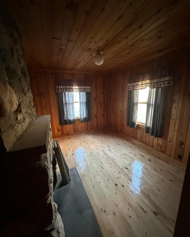 Refinished pine hardwood floor with a glossy finish
