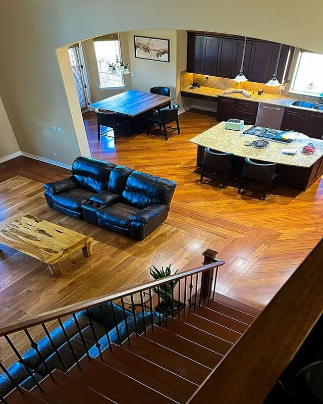 Open-plan living area with refinished hardwood floors